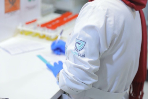 A woman is working with lab device